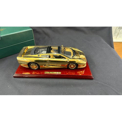 81 - Boxed Jaguar XJ220 a 22 carat gold plate limited edition model car on stand, overall length of car 1... 