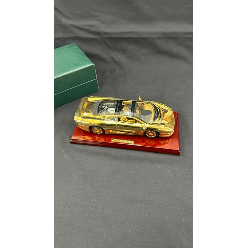 81 - Boxed Jaguar XJ220 a 22 carat gold plate limited edition model car on stand, overall length of car 1... 