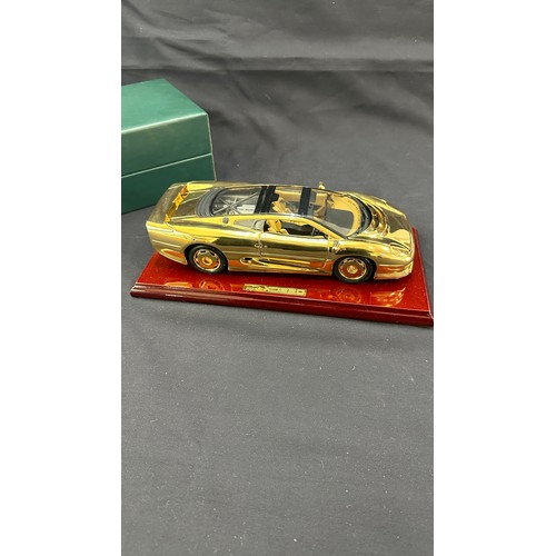 81 - Boxed Jaguar XJ220 a 22 carat gold plate limited edition model car on stand, overall length of car 1... 