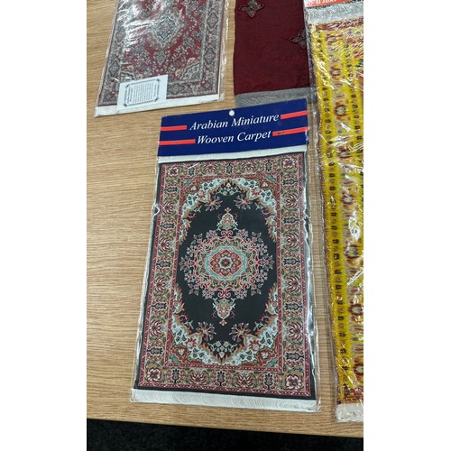 139 - Selection of Arabian miniature woven carpet and other