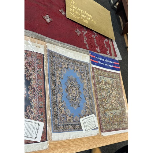 139 - Selection of Arabian miniature woven carpet and other