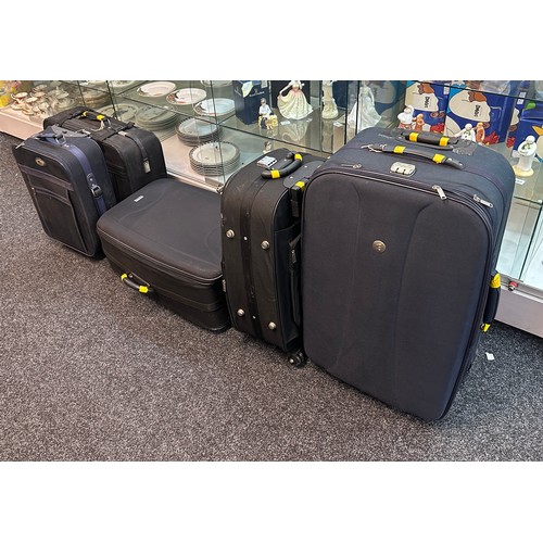 297 - Selection of five various sized suitcases- A/F