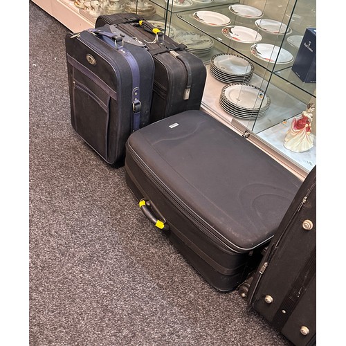 297 - Selection of five various sized suitcases- A/F