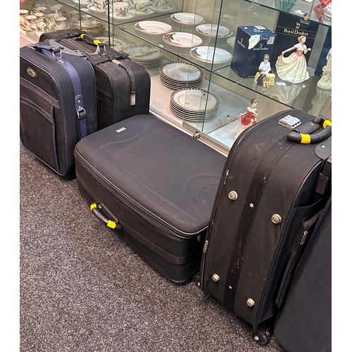 297 - Selection of five various sized suitcases- A/F