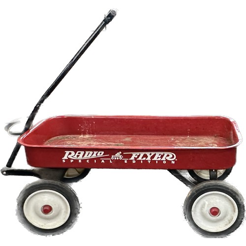 100Q - Radio flyer special edition 0990 trolley with four wheels measures 34 inches long 15.5 wide