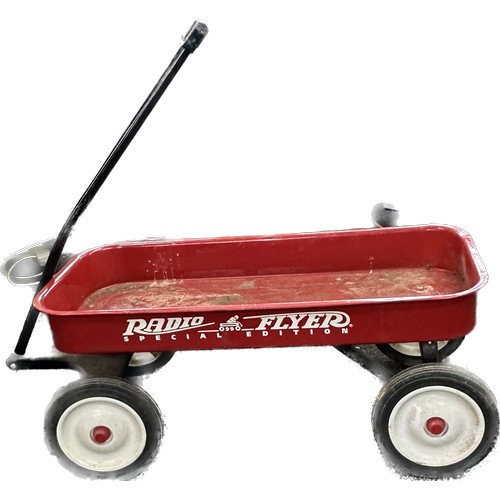 100Q - Radio flyer special edition 0990 trolley with four wheels measures 34 inches long 15.5 wide