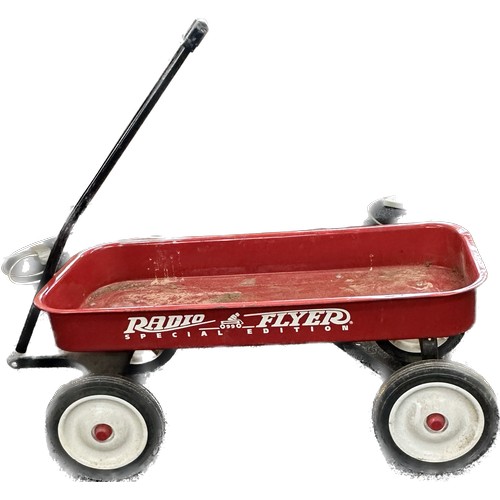 100Q - Radio flyer special edition 0990 trolley with four wheels measures 34 inches long 15.5 wide