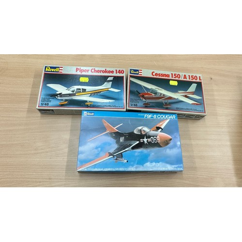 63 - Three Revell air craft model kits to include ' Cessna 150 A150L', 'Piper Cherokee 140', 'F9F-8 Couga... 