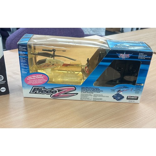 148 - Two remote control helicopters one ' Bladez transporter gyro helicopter' the other a 'PicooZ 85615' ... 