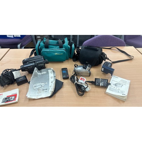 93 - Two cameras with bags and accessories to include Canon Elura and a Panasonic NV-S90 - untested