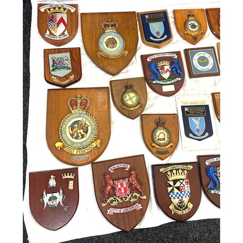 134 - Large quantity of vintage RAF and local authority shields and plaques with squadron insignia and coa... 