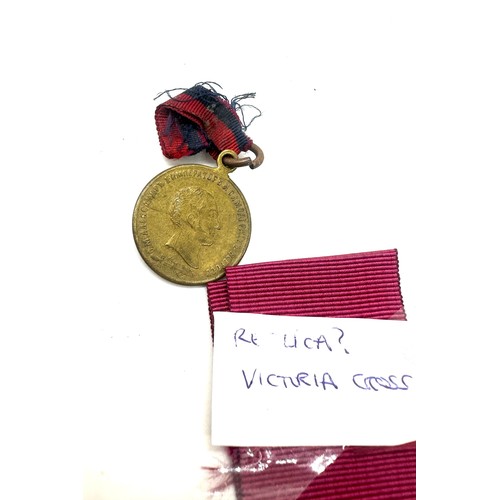 415 - Selection of replica medals includes Victorian cross, WW1 medals etc