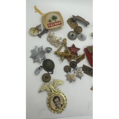 416 - Large selection of assorted cap badges etc