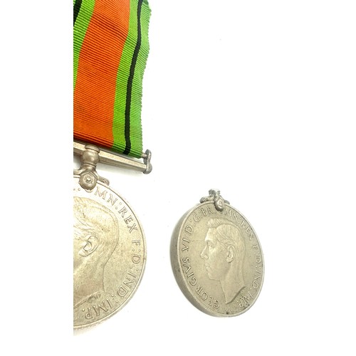 402 - 2 WWII Defence medals, one with ribbon