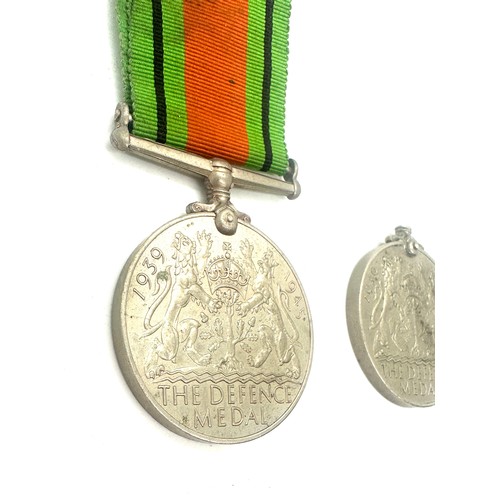 402 - 2 WWII Defence medals, one with ribbon