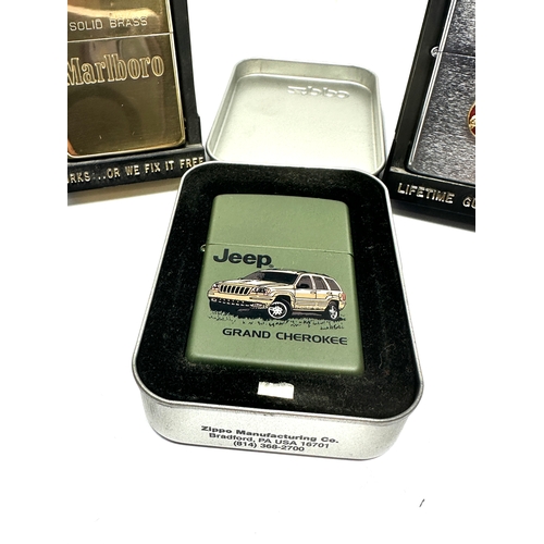 3 cased Zippo lighters inc marlboro jaguar etc all in as new condition