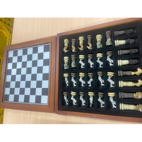 214 - Scrabble board game and a chess set