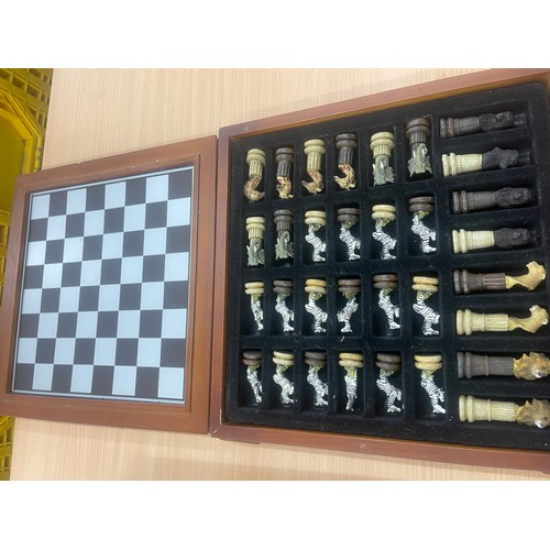 214 - Scrabble board game and a chess set