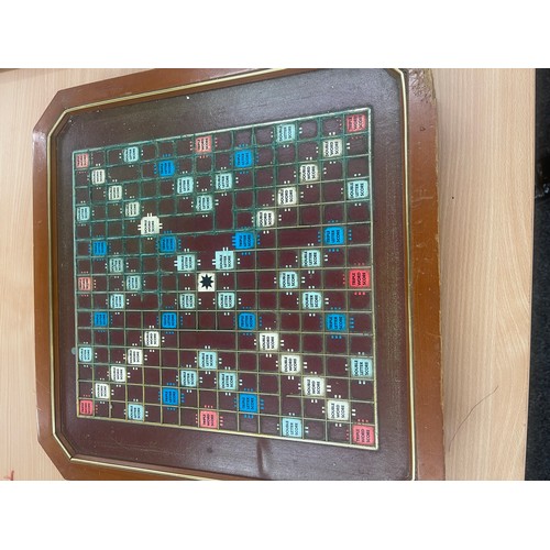 214 - Scrabble board game and a chess set