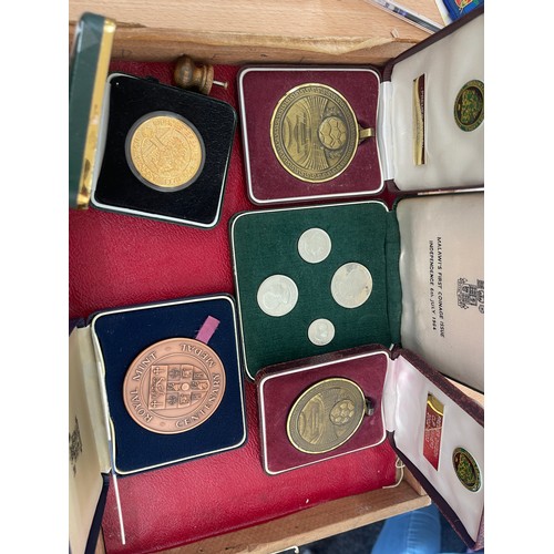 571 - Selection of cased coins and medals