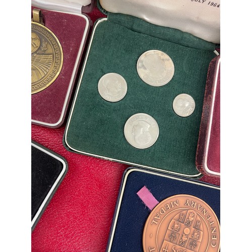 571 - Selection of cased coins and medals