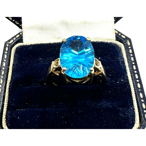 77 - 9ct gold  blue topaz ring weight 4.8g