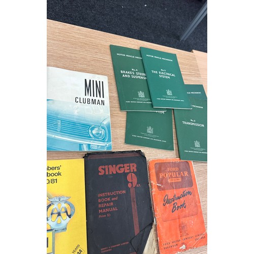 255 - Collection of car manuals + 1957/8 AA badge