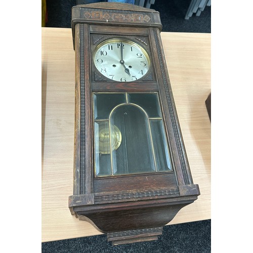 200 - Oak Edwardian wall clock overall length 32 inches