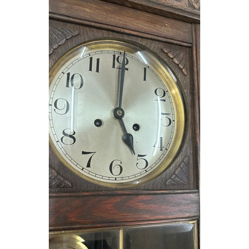 200 - Oak Edwardian wall clock overall length 32 inches