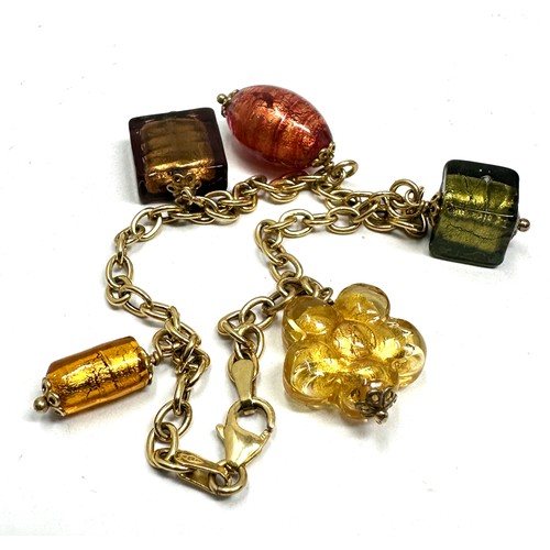 87 - 9ct gold charm bracelet glasss charms weight 10.5g