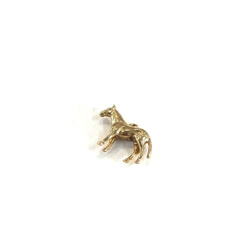 468 - 9ct gold horse charm , total weight 2.6g