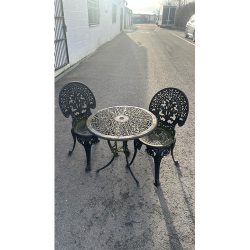 100Z - cast iron table and two chairs