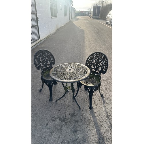 100Z - cast iron table and two chairs