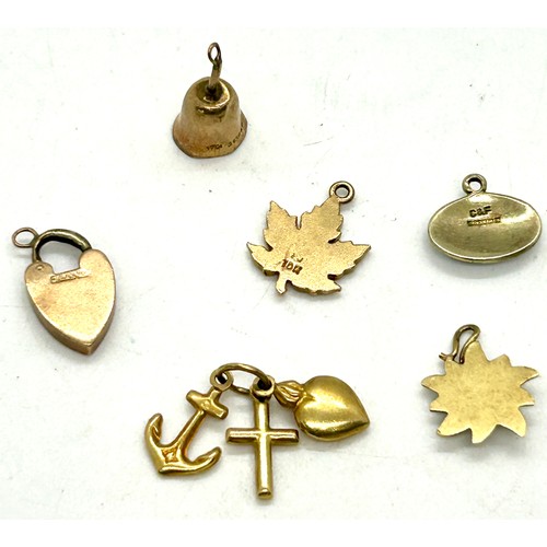 484 - Selection of 9ct gold charms, approximate weight 5.9g