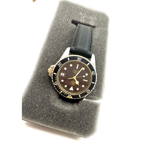 438 - Gent Tag Heuer 1000 81 steel gold plated wrist watch with Quartz movement, unboxed but comes with a ... 