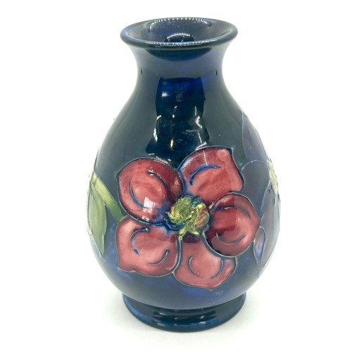 616 - Moorcroft Clematis pattern bulbous vae, circular foot, overall height 13cm