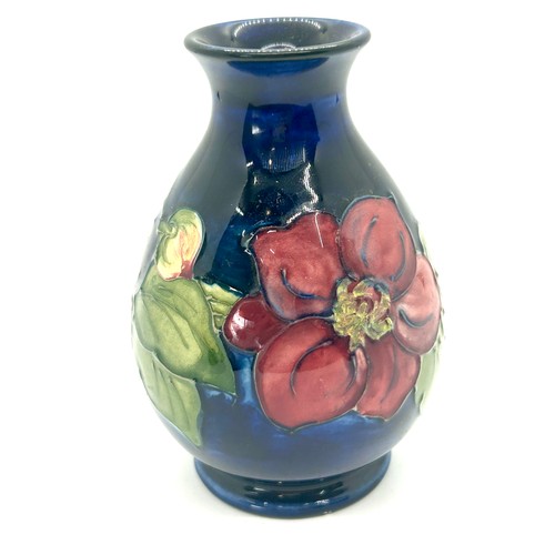 616 - Moorcroft Clematis pattern bulbous vae, circular foot, overall height 13cm