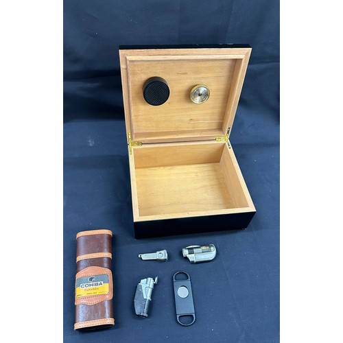 94 - Cedar wood leather topped humidor, Cohiba cigar case, 2 cigar cutters and 2 cigar lighters