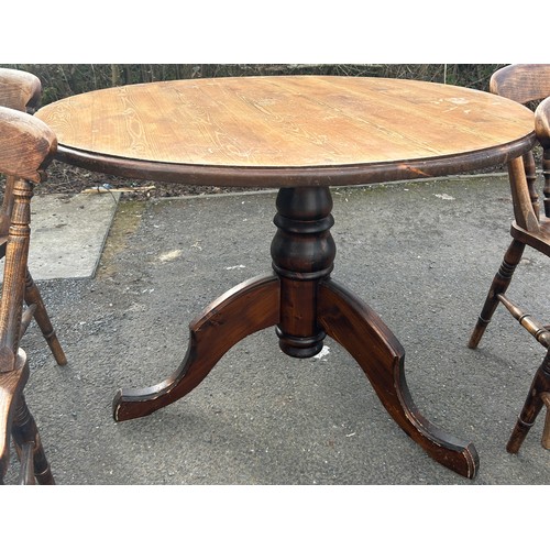 326 - Dark stained Pine round pedestool table and 4 elm chairs. Table diameter 44 inches, table height 29 ... 