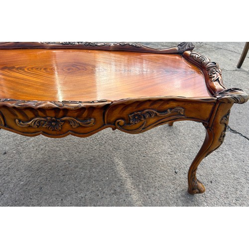 331 - Mahogany carved coffee table, approximate measurements: Height 17 inches,  length 37 inches, Depth 2... 