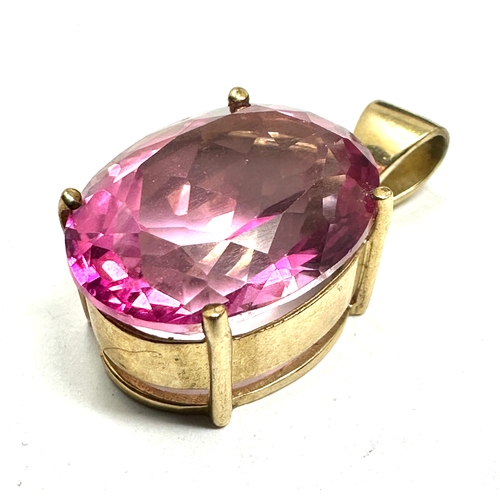 114 - 9ct gold syn pink sapphire  pendant weight 8.8g