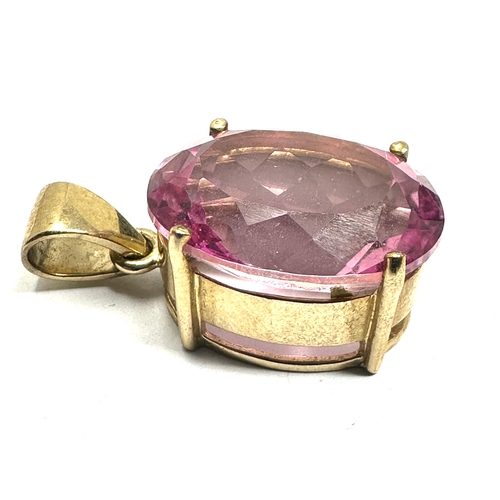 114 - 9ct gold syn pink sapphire  pendant weight 8.8g