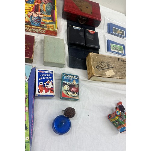 143 - Selection of vintage games, Chinese chequers, nursery rhyme puzzle, Bristol playing cards in leather... 