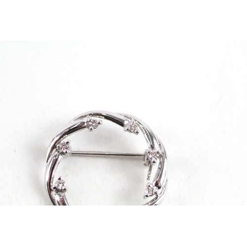 187 - 9ct white gold diamond set circlet brooch (2.4g)