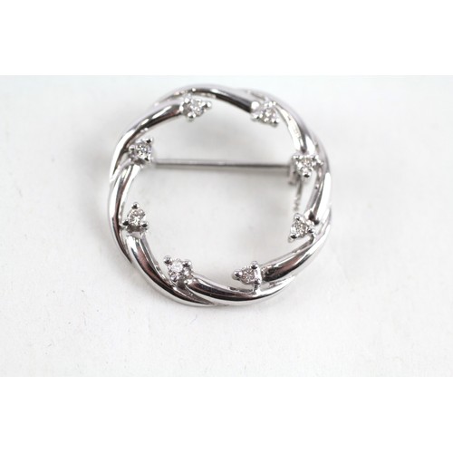 187 - 9ct white gold diamond set circlet brooch (2.4g)