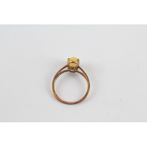 189 - 9ct gold treated opal solitaire ring (1.6g)