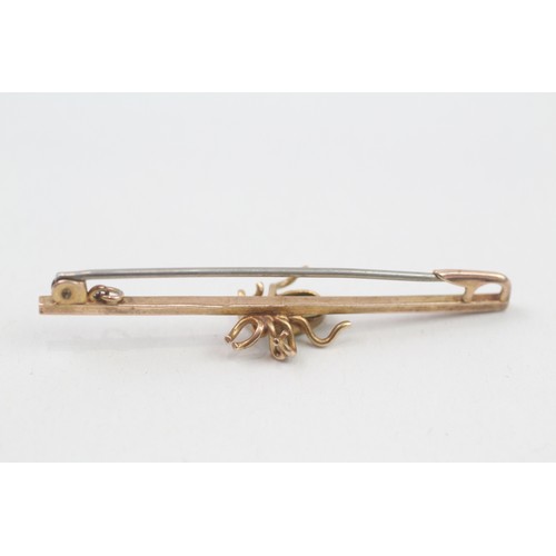 226 - 9ct gold green paste spider bar brooch (2g)