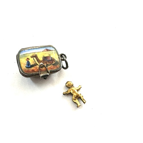 530 - Egyptian silver and enamel basket charm with baby