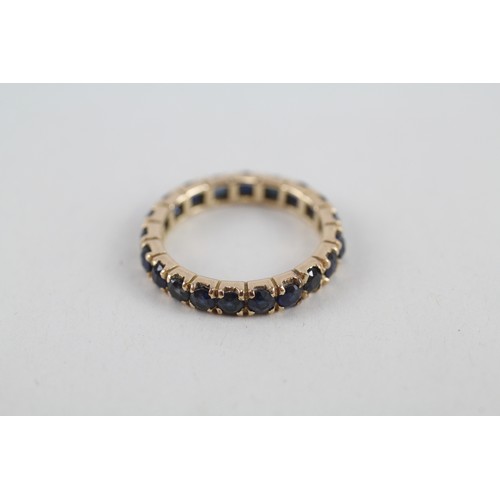 254 - 9ct gold sapphire full eternity ring (2.2g) ring size h/i