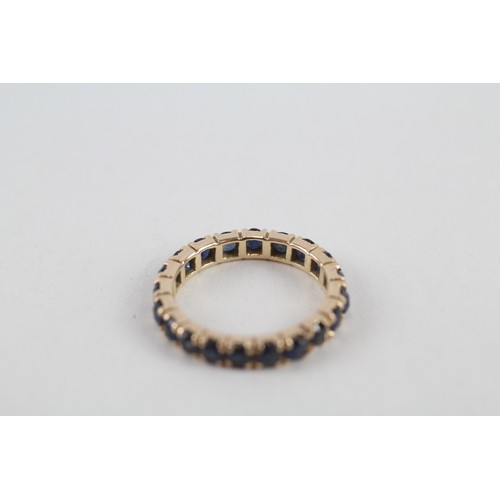 254 - 9ct gold sapphire full eternity ring (2.2g) ring size h/i